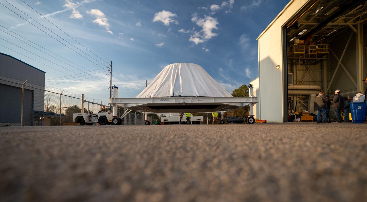 These photos and videos show how crews at NASA’s Marshall Space Flight Center in Huntsville, Alabama, moved and installed the payload adapter that will be used in the Block 1B configuration of the SLS (Space Launch System) rocket from Building 4708, where it was manufactured, into Structural Test Stand 4697 at NASA’s Marshall Space Flight Center on March 13. Teams at Marshall will begin structural testing the engineering development unit of the payload adapter – an exact replica of the flight version of the hardware – this spring. The cone-shaped payload adapter is about 8.5 feet tall and features two metal rings and eight composite panels. The adapter, which will debut on NASA’s Artemis IV mission, is an evolution from the Orion stage adapter used in the Block 1 configuration of the first three Artemis missions. It will be housed inside the universal stage adapter atop the rocket’s more powerful in-space stage, called the exploration upper stage. The payload adapter, like the launch vehicle stage adapter and the Orion stage adapter, is fully manufactured and tested at Marshall, which manages the SLS Program. NASA is working to land the first woman, first person of color, and its first international partner astronaut on the Moon under Artemis. SLS is part of NASA’s backbone for deep space exploration, along with the Orion spacecraft and Gateway in orbit around the Moon and commercial human landing systems, next-generational spacesuits, and rovers on the lunar surface. SLS is the only rocket that can send Orion, astronauts, and supplies to the Moon in a single launch. 